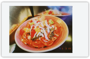 A photo of a bowl of pistachio pesto pasta.